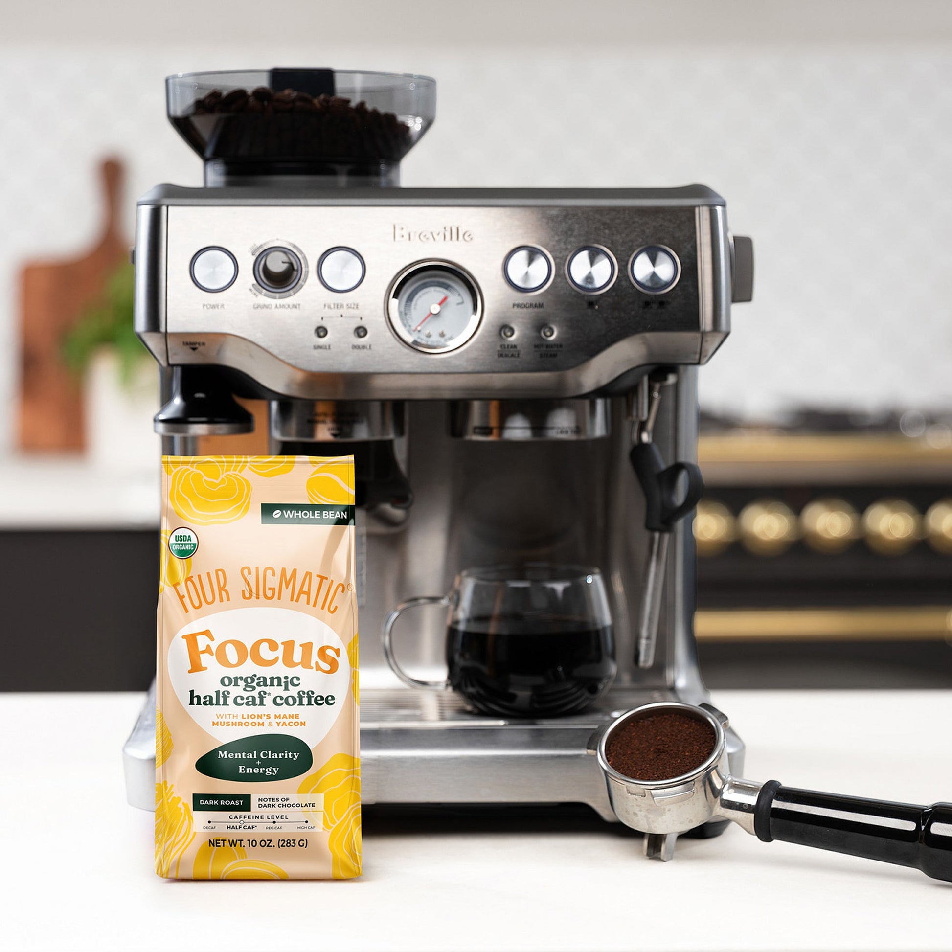 focus-half-caf-whole-bean-coffee-v8 Focus_Org_Dark_Roast_High_Caf_Kitchen_Pour_Woman_4_47b71a0c-c7fc-40fd-a2bc-fa7389dfb410.jpg